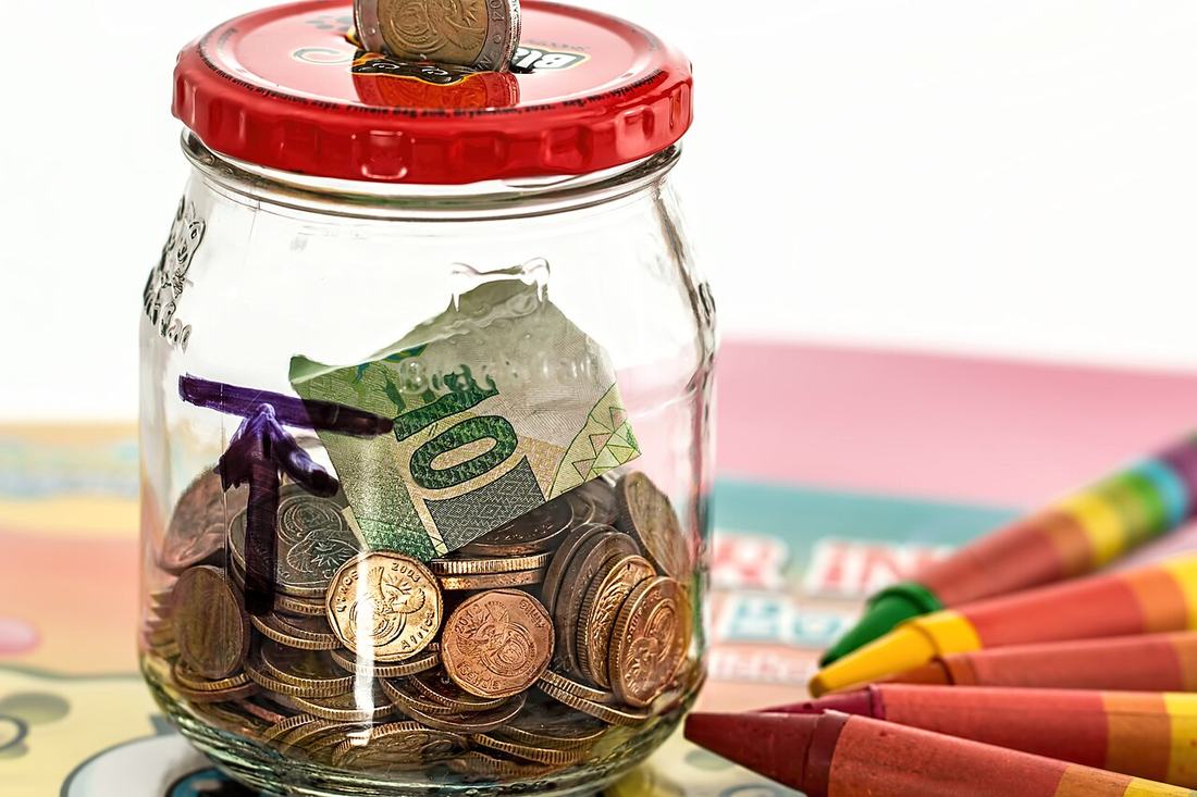 A savings jar filled with coins