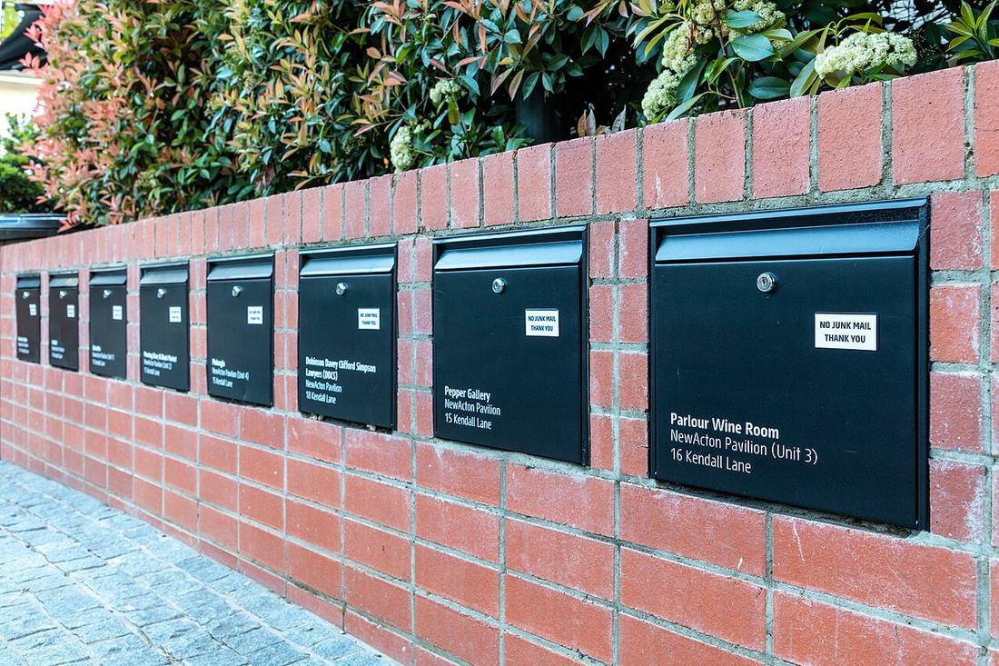 Letter boxes in a brick wall in Canberra