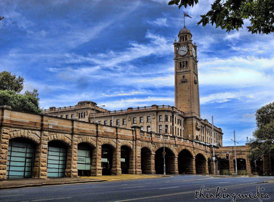 A historic railway station building with a clock tower